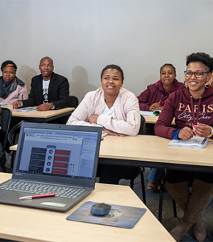 Adult learners attending a professional computer skills and digital training workshop