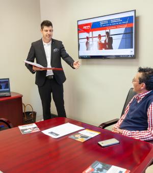 Business consultant presenting during a corporate meeting and professional training session