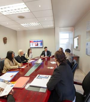 Business professionals participating in a collaborative boardroom meeting and discussion