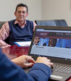 Business professionals collaborating during a corporate meeting in a modern boardroom