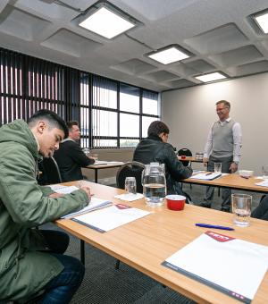 Adult learners attending a professional workplace training workshop
