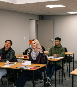 Corporate trainer engaging with participants during an interactive business workshop
